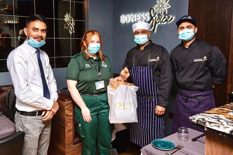 Bo’ness Spice's Mohammad Abbas (on the left) with Ambulance Technician Trainee Megan Aitken and Bo’ness Spice chefs Forhad Miah (far right) and Prince Morol.