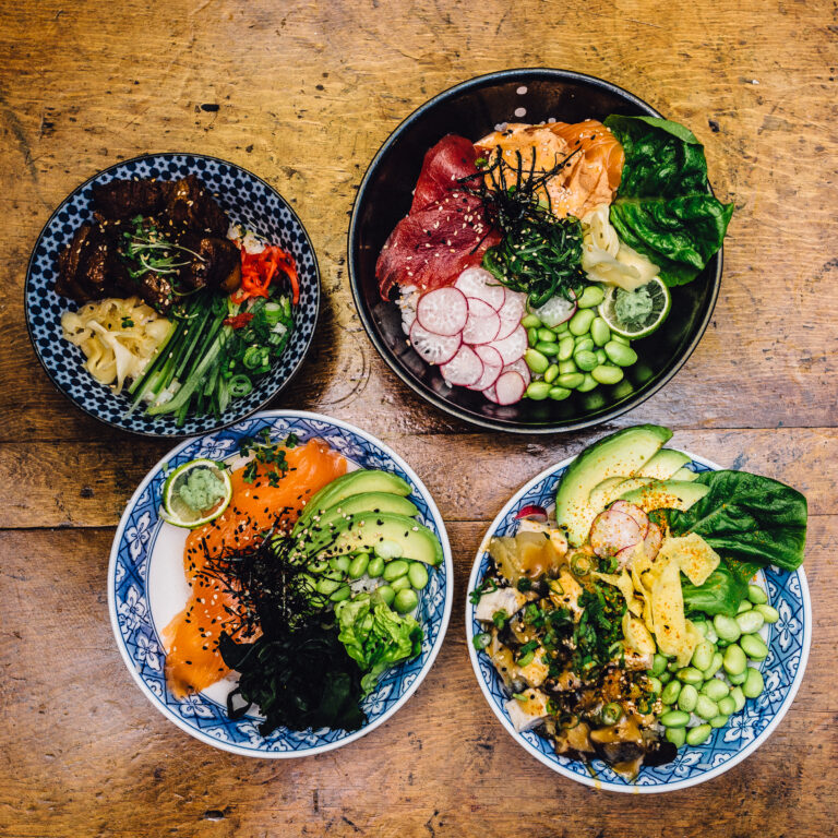 Four bowls of Japanese food, including bright vegetables, salmon, tofu and more from Harajuku Kitchen, Edinburgh
